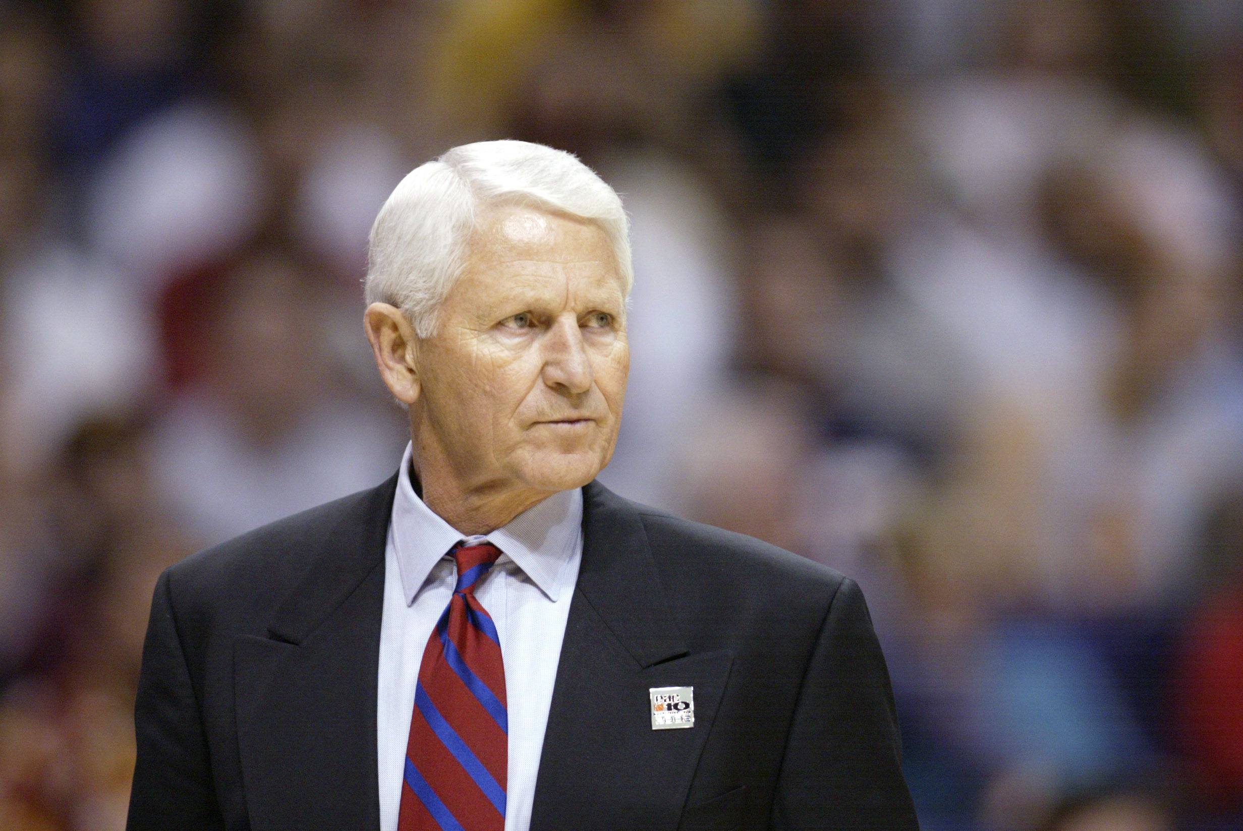 Lute Olson watches from the sideline.
