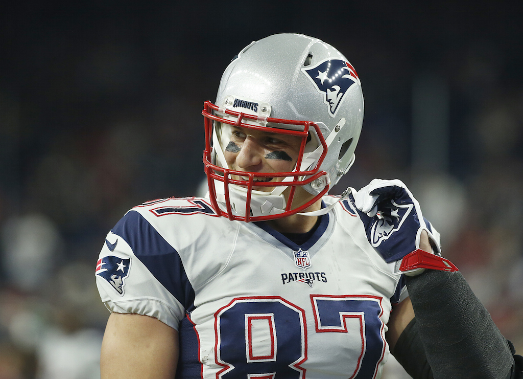 Rob Gronkowski #87 of the New England Patriots watches the Houston Texans warm up