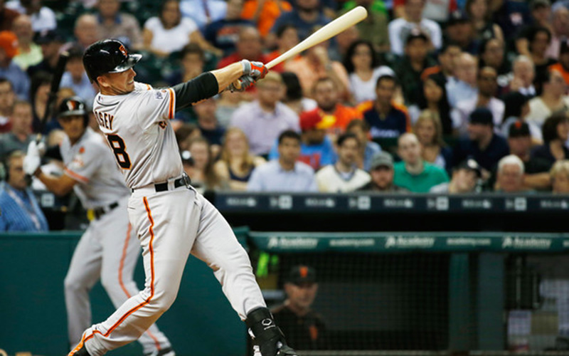 Buster Posey follows through on a home run.