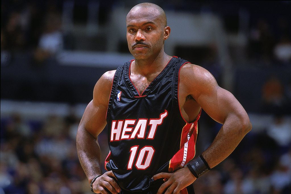 Tim Hardaway stands with his hands on his hips during a timeout.