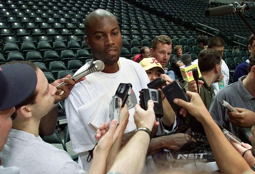 Glen Rice talks to reporters.