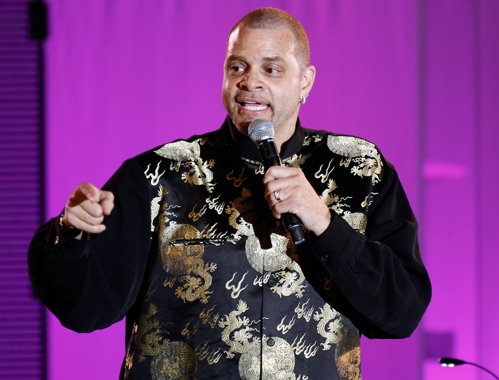 Sinbad performs onstage.