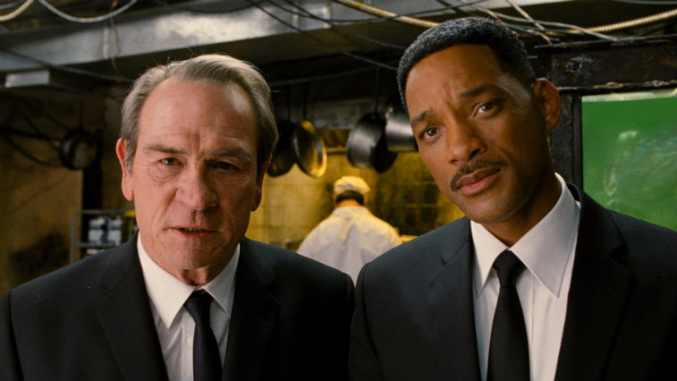Tommy Lee Jones and Will Smith on set of a movie.