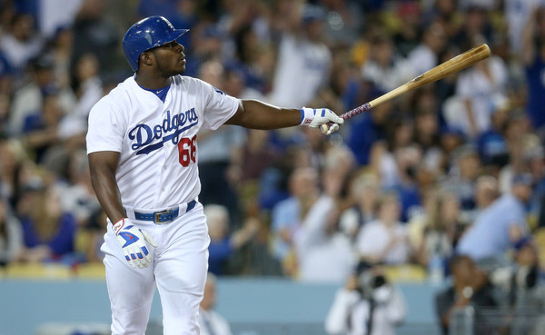 Los Angeles Dodgers outfielder Yasiel Puig indicates his batting target