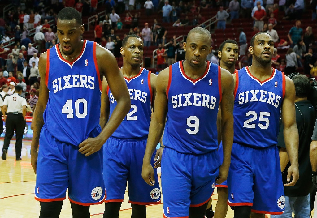 Members of the 76ers walk off the court after losing a game