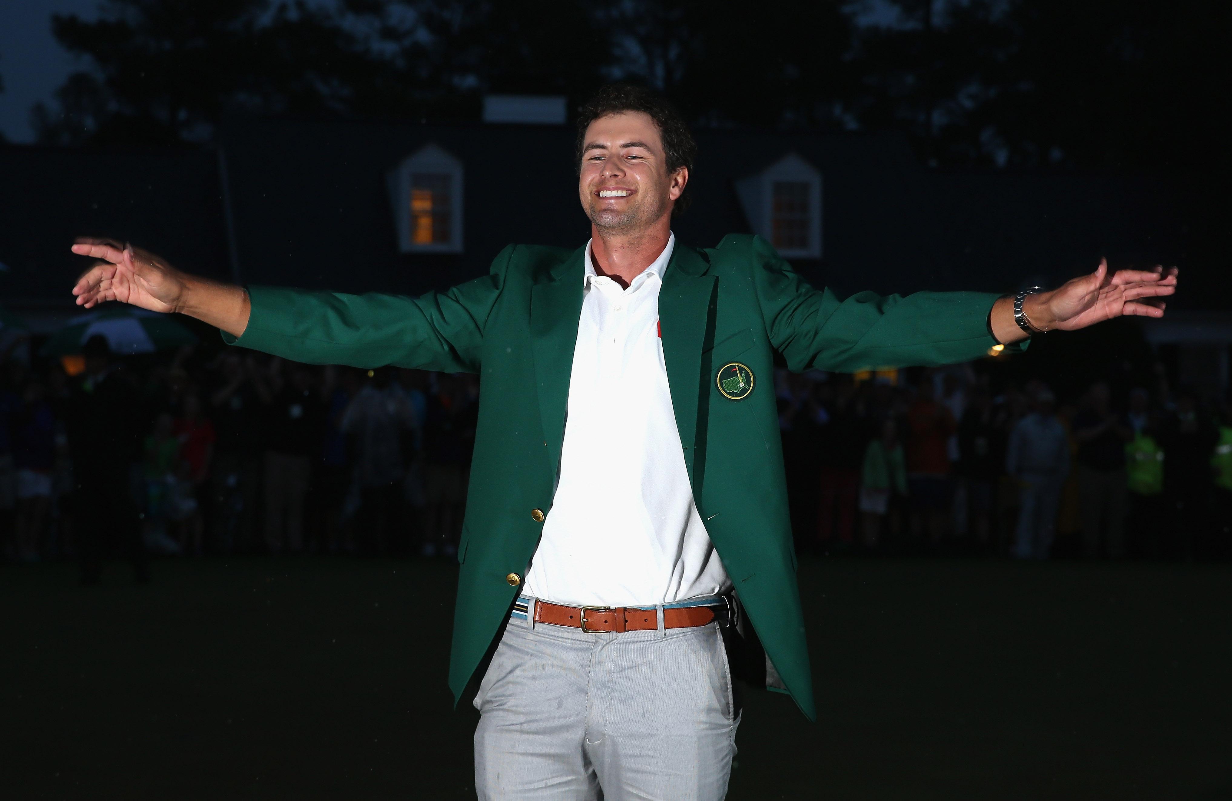 Adam Scott celebrates his green jacket.