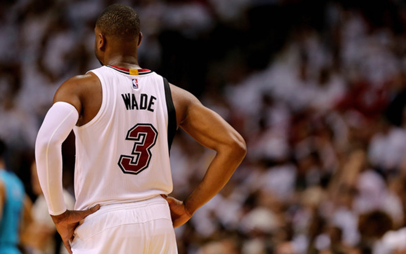 Dwyane Wade stands on the court.