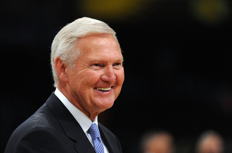 Jerry West smiles as he stands courtside.