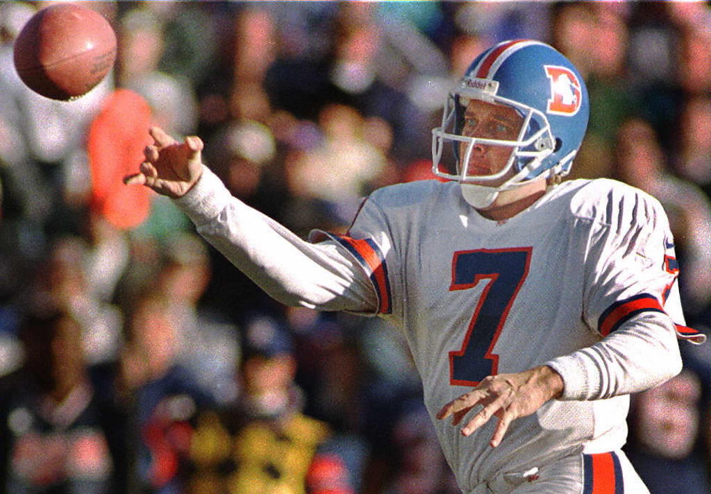 Denver Broncos quarterback John Elway passes the ball.