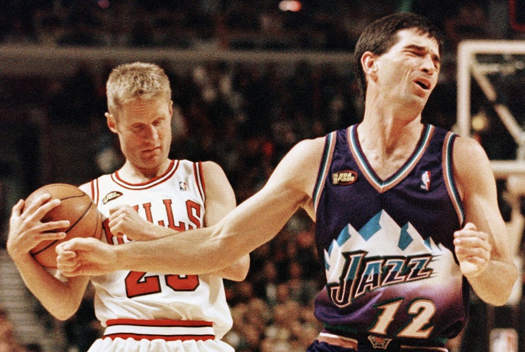 Utah's John Stockton (R) reacts to being called for a foul.