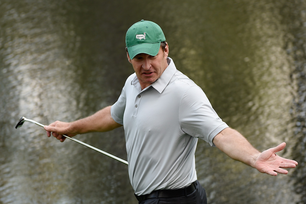 Nick Faldo reacts to a shot during the 2014 Par 3 Contest 