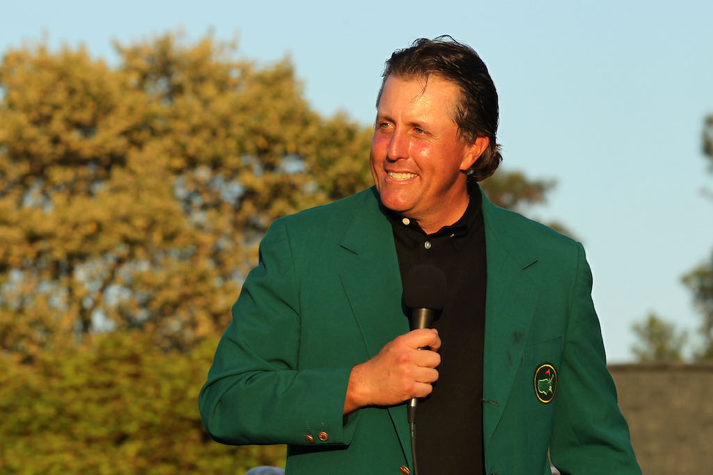 Phil Mickelson smiles while wearing his green jacket. 