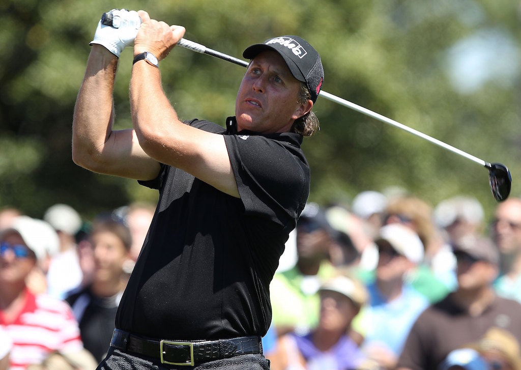 Phil Mickelson follows through and looks to the sky.