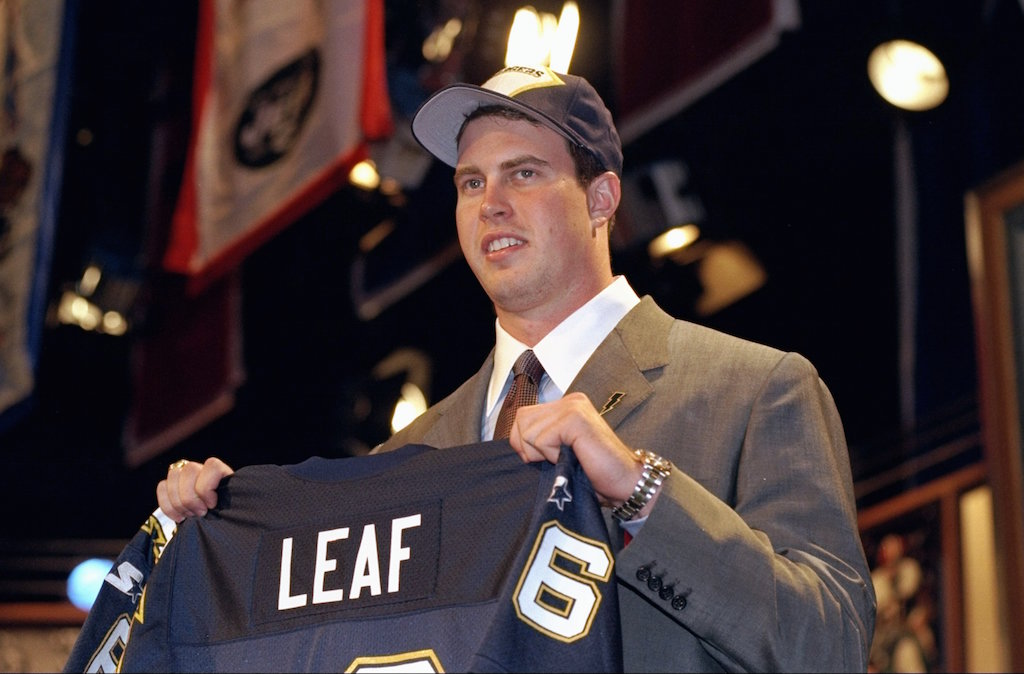 Second overall pick Ryan Leaf shows off his jersey after being selected by the San Diego Chargers in the first round of the 1998 NFL Draft at Madison Square Garden in Manhattan, New York.
