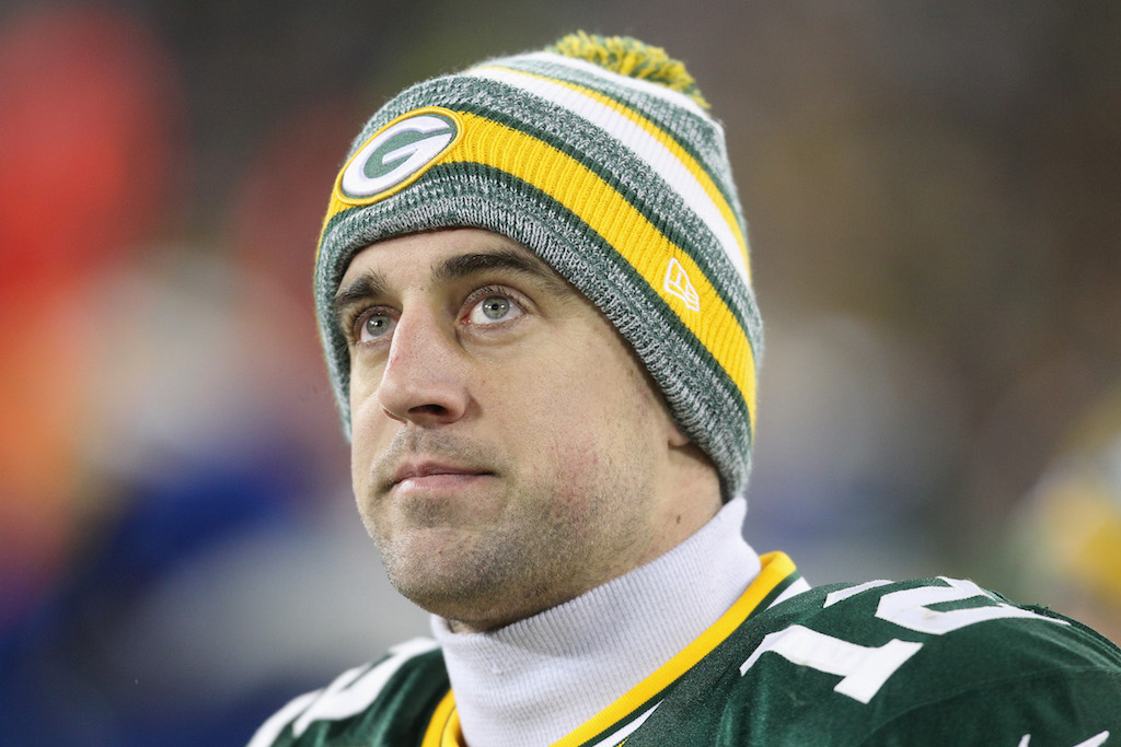 Quarterback Aaron Rodgers #12 of the Green Bay Packers looks on during an NFL game.