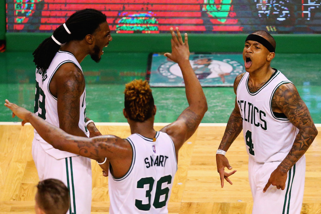 Isaiah Thomas celebrates with Marcus Smart and Jae Crowder during the NBA playoffs.