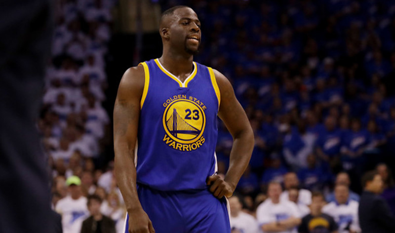 Draymond Green takes a breather on the court.