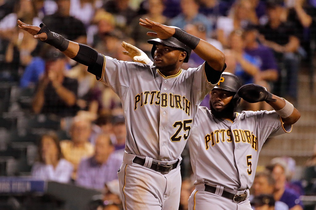 DENVER, CO - SEPTEMBER 23: Gregory Polanco #25 and Josh Harrison #5 of the Pittsburgh Pirates celebrate after scoring on a double by Starling Marte #6 of the Pittsburgh Pirates off of starting pitcher Christian Bergman of the Colorado Rockies to take a 7-1 lead in the fourth inning at Coors Field on September 23, 2015 in Denver, Colorado.