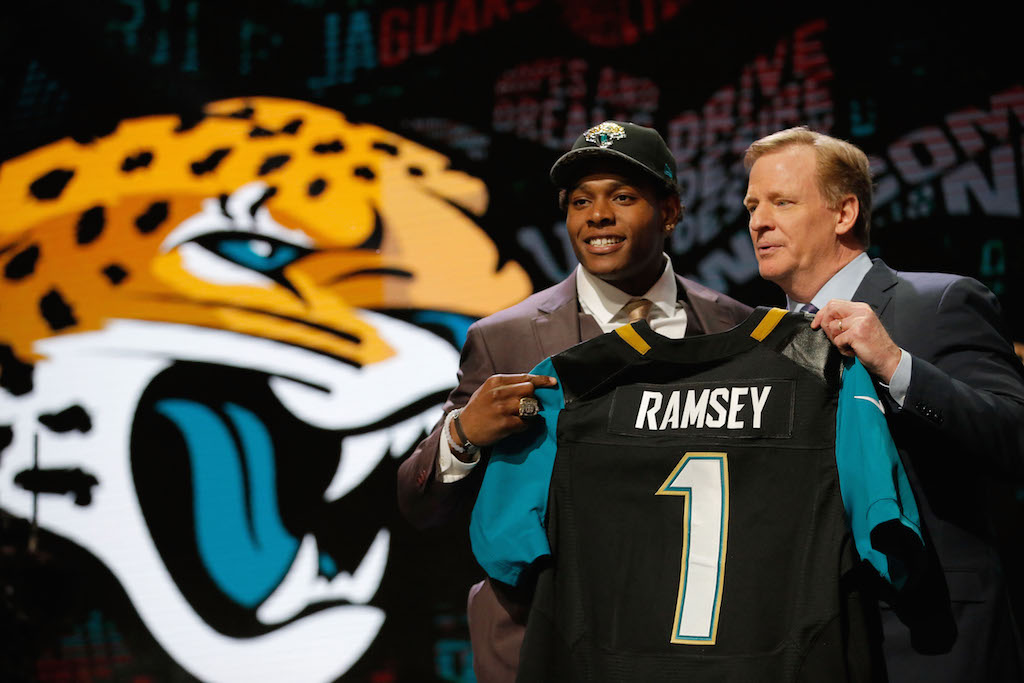 Jalen Ramsey of the Florida State Seminoles holds up a jersey with NFL Commissioner Roger Goodell after being picked #5 overall by the Jacksonville Jaguarsduring the first round of the 2016 NFL Draft at the Auditorium Theatre of Roosevelt University on April 28, 2016 in Chicago, Illinois.