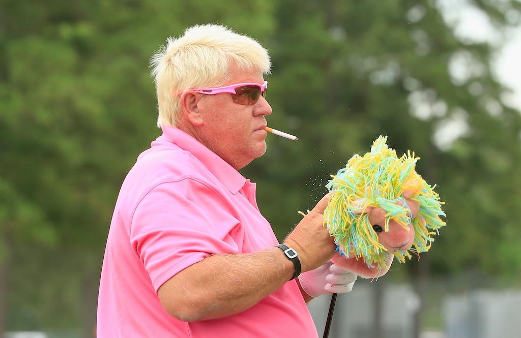 Infamous pro golfer John Daly waits on the practice ground during Insperity Invitational.
