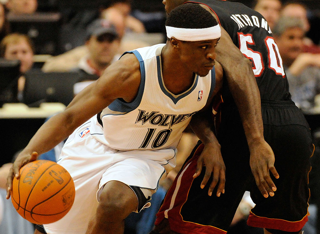 Jonny Flynn, #10 of the Minnesota Timberwolves, dribbles around Joel Anthony, #50 of the Miami Heat, during a basketball game at Target Center on April 1, 2011 in Minneapolis, Minnesota.