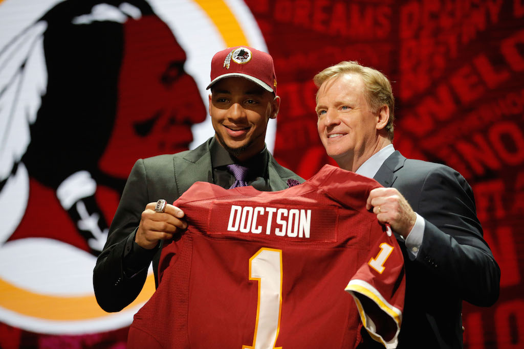 Josh Doctson of TCU holds up a jersey with NFL Commissioner Roger Goodell after being picked by the Washington Redskins.