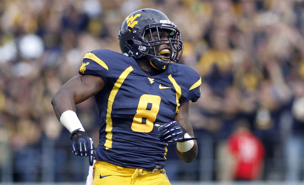 Karl Joseph #8 of the West Virginia Mountaineers pumps up the crowd against the Baylor Bears during the game on September 29, 2012 at Mountaineer Field in Morgantown, West Virginia.