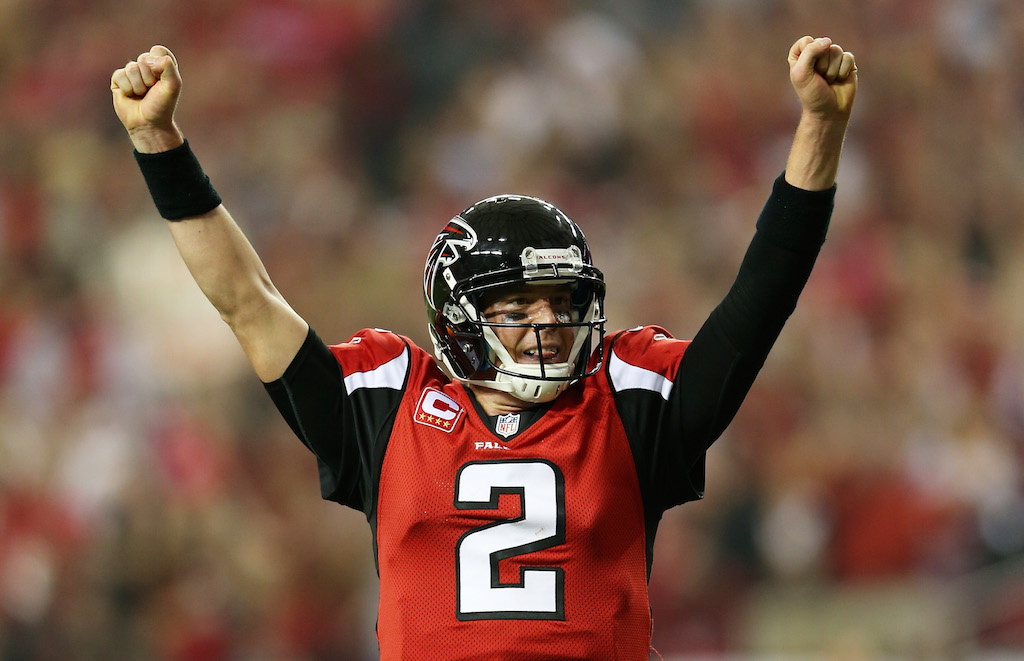 Matt Ryan pumps his fists in the air after winning a game.