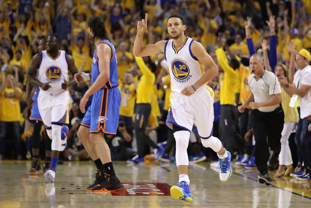 Stephen Curry reacts after knocking down a big triple. | Ezra Shaw/Getty Images