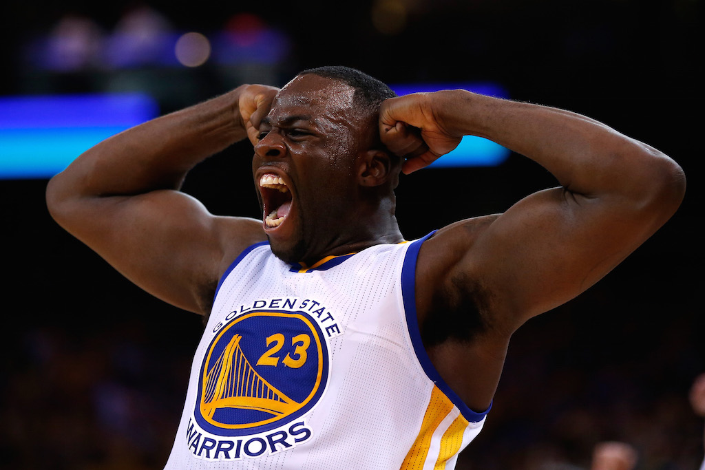 Draymond Green pumps up the crowd during a Golden State Warriors game