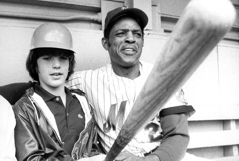 John F. Kennedy Jr is seen with Mets baseball player Willie Mays at Shea Stadium in New York