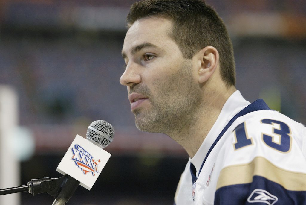 Kurt Warner talks during a media conference.