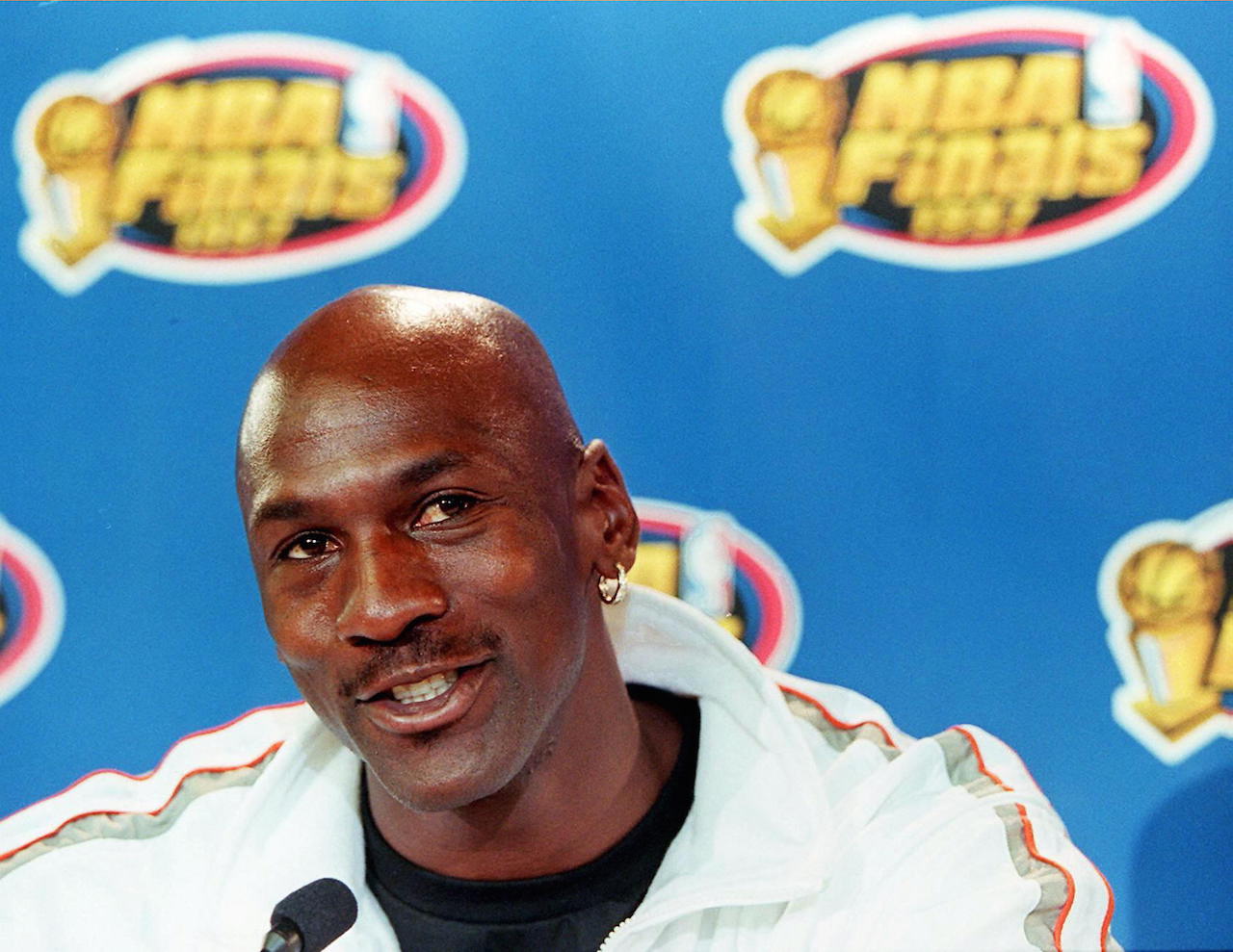 Michael Jordan speaks with reporters during NBA FInals.