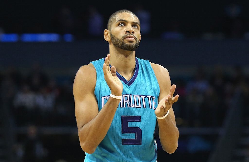 Nicolas Batum claps after the play.