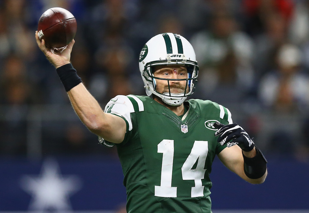 Ryan Fitzpatrick grips the football and looks for a target.