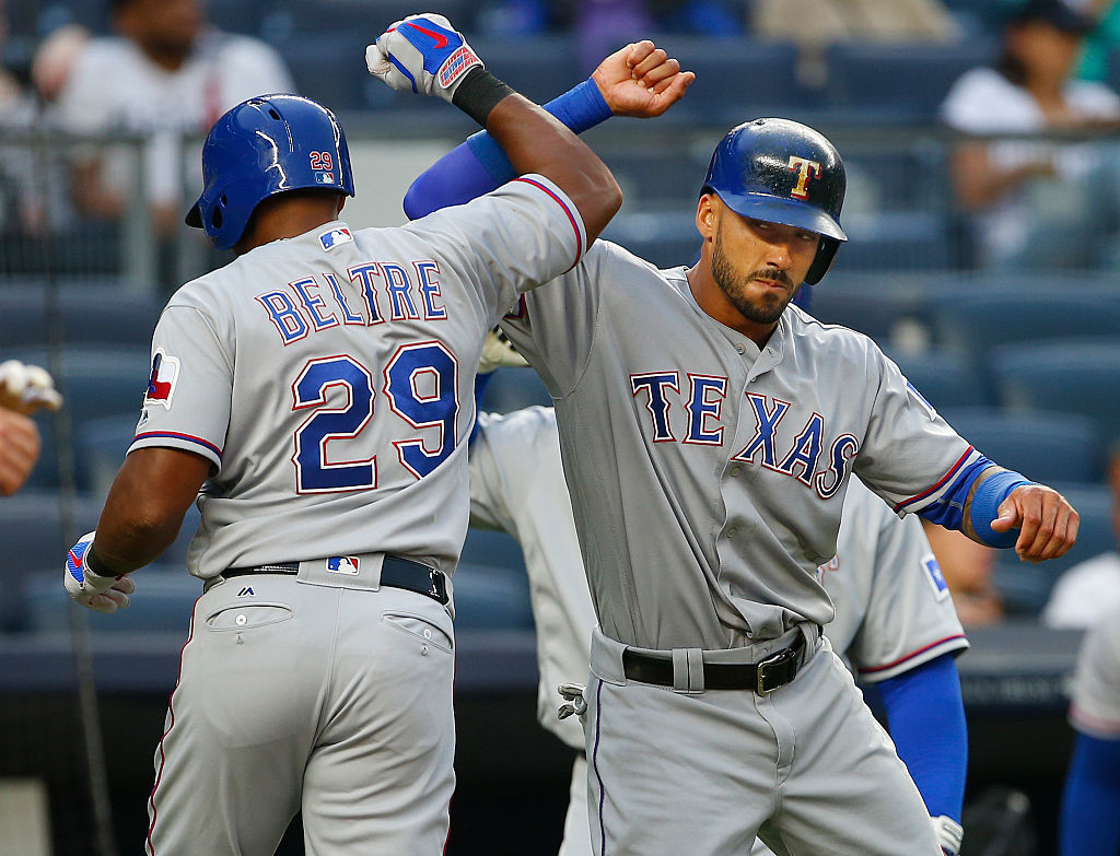 Adrian Beltre of the Texas Rangers is congratulated by Ian Desmond.