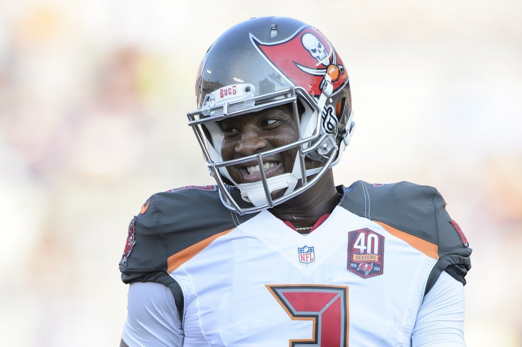 Jameis Winston smiles after throwing a touchdown pass.