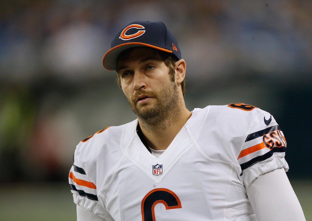 Jay Cutler stands on the sidelines during a game.