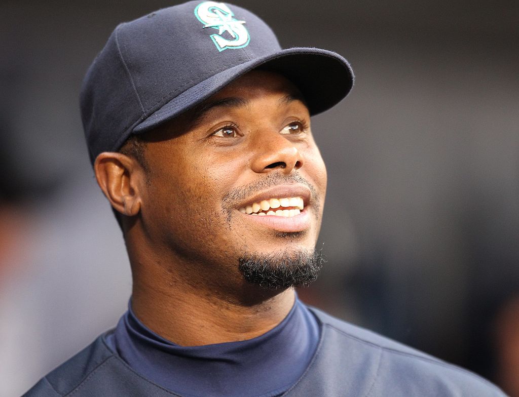 Ken Griffey Jr. #24 of the Seattle Mariners smiles in the dugout