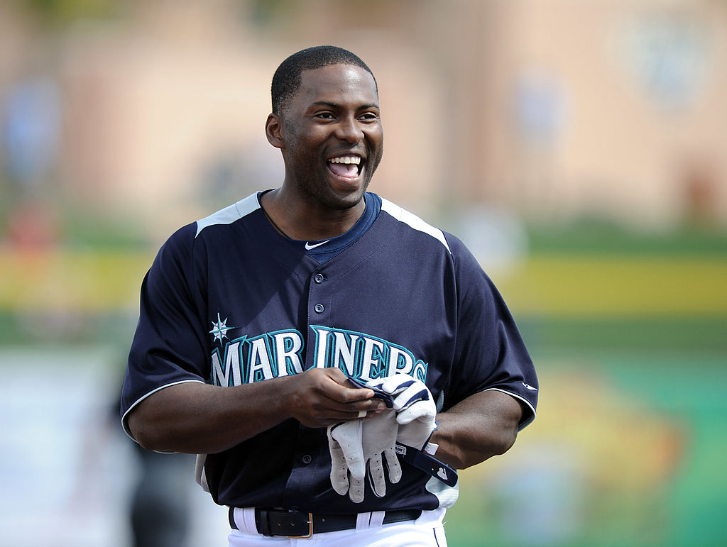 Milton Bradley of the Seattle Mariners smiles as he leaves the field