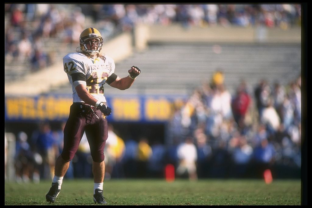 The late Pat Tillman, formerly of the Arizona State Sun Devils, throws for a touchdown.