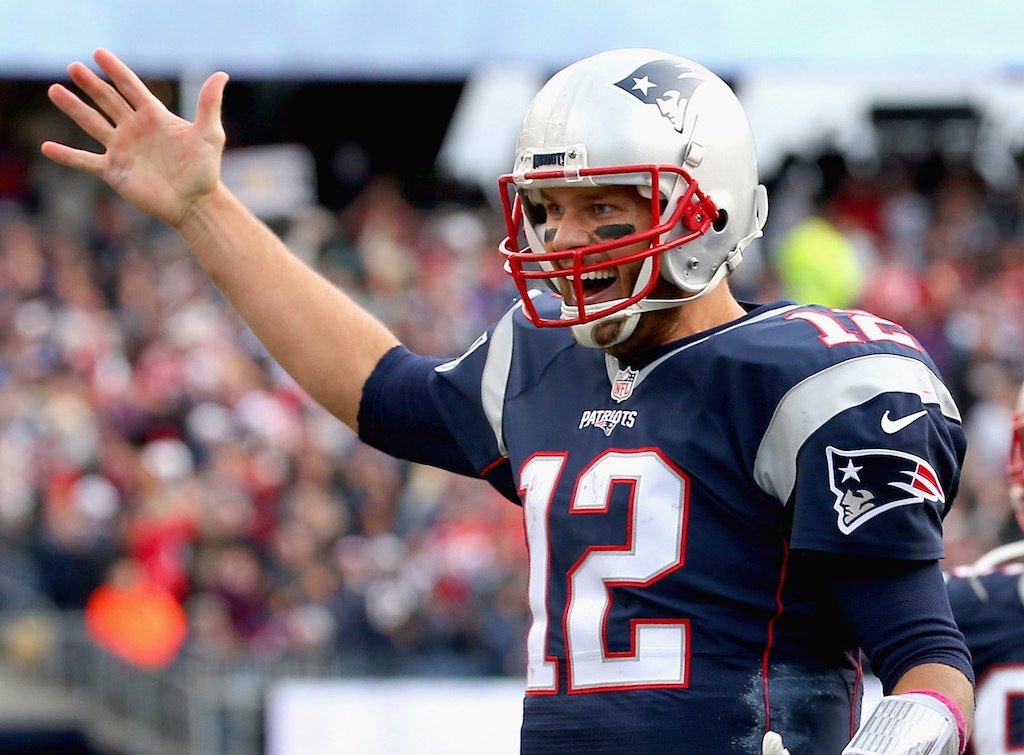 Tom Brady celebrates winning with his teammates.