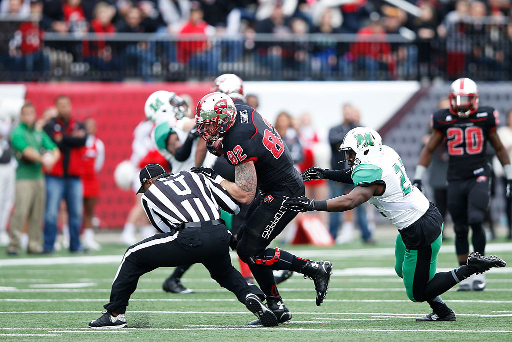 Tyler Higbee #82 of the Western Kentucky Hilltoppers runs into umpire Sheldon Davis after a reception against the Marshall Thundering Herd in the first half of the game at L.T. Smith Stadium on November 27, 2015 in Bowling Green, Kentucky. (Photo by Joe Robbins/Getty Images)