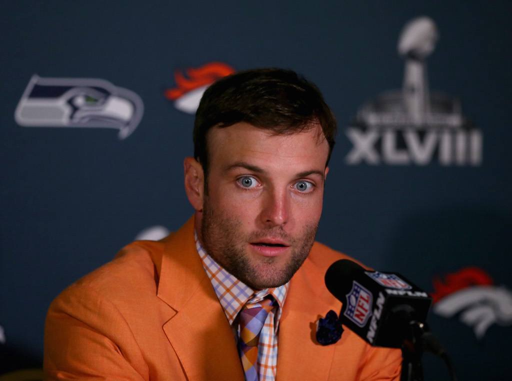 Wes Welker speaks to journalists during a press conference | Elsa/Getty Images