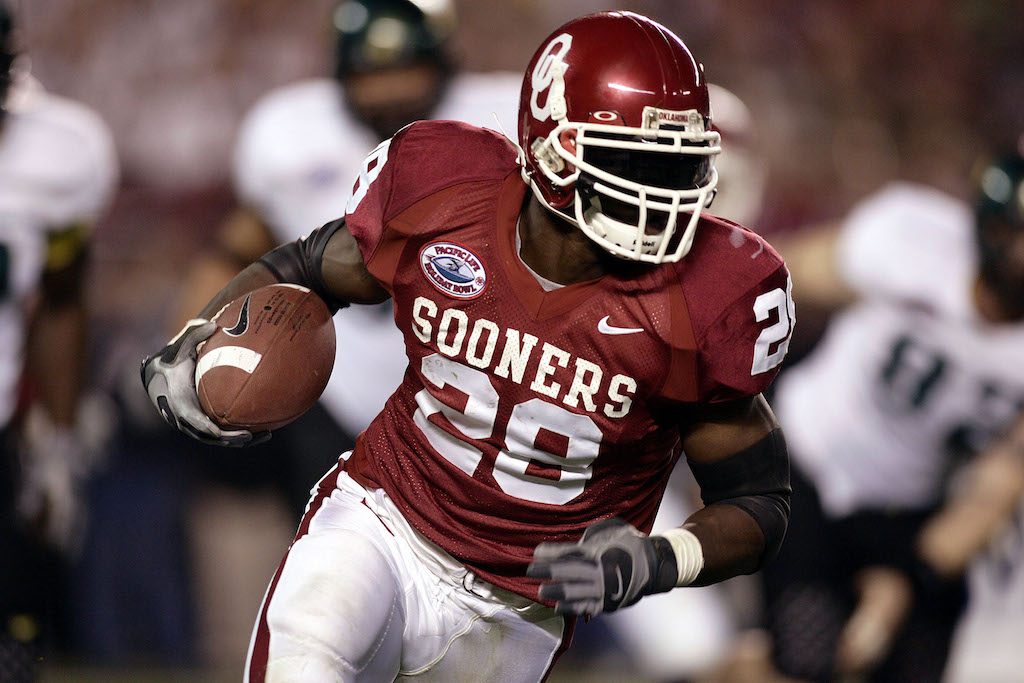 The Sooners rush the football toward the end zone.