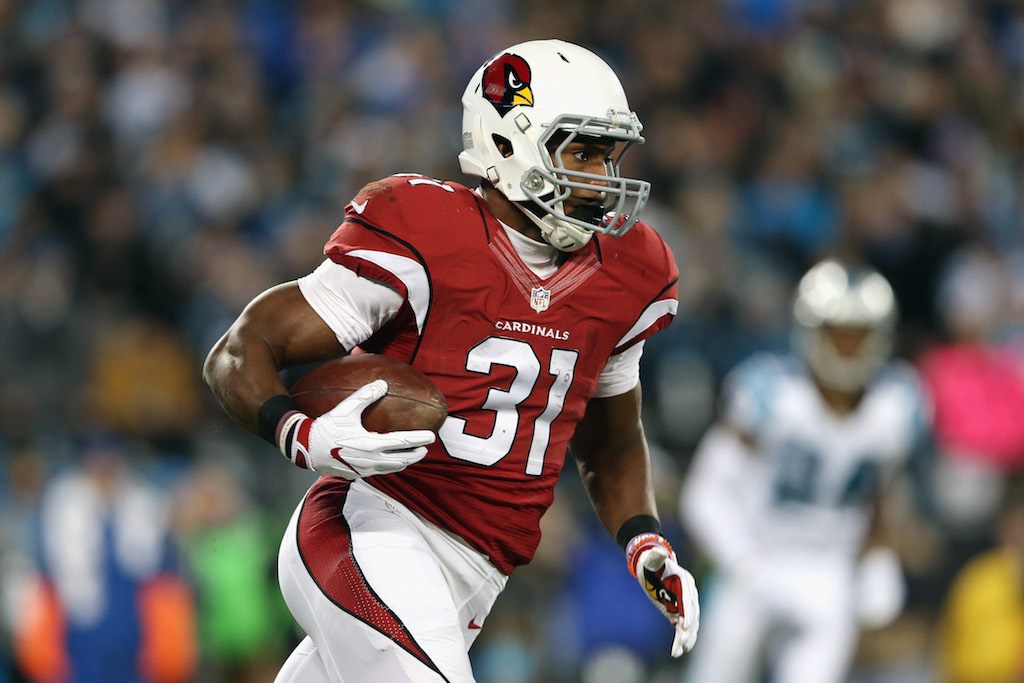 CHARLOTTE, NC - JANUARY 24: David Johnson #31 of the Arizona Cardinals carries the ball in the first half against the Carolina Panthers during the NFC Championship Game at Bank of America Stadium on January 24, 2016 in Charlotte, North Carolina. (Photo by Streeter Lecka/Getty Images)