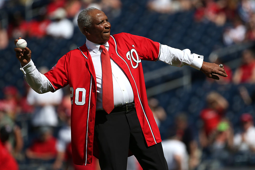 Baseball Hall of Famer Frank Robinson throws out the first pitch before the Atlanta Braves play the Washington Nationals at Nationals Park on May 9, 2015 in Washington, DC
