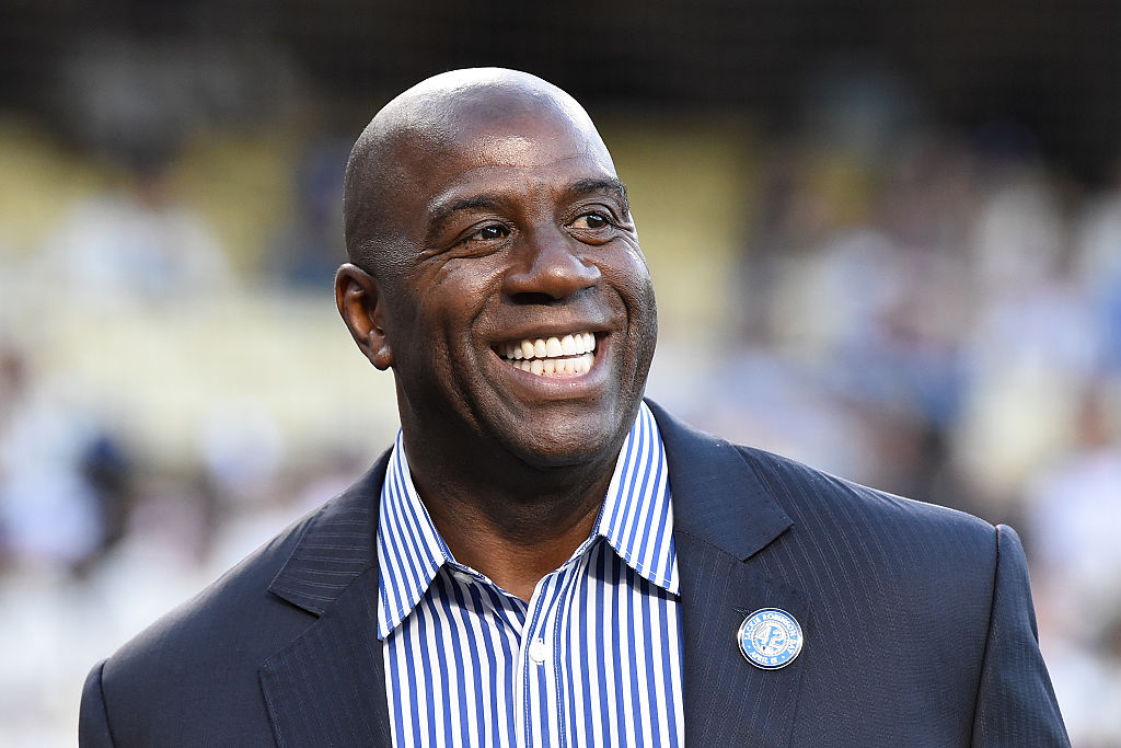 Magic Johnson attends a ceremony honoring Jackie Robinson before the game between the San Francisco Giants and the Los Angeles Dodgers at Dodger Stadium on April 15, 2016 in Los Angeles, California. All players are wearing #42 in honor of Jackie Robinson Day. | Lisa Blumenfeld/Getty Images