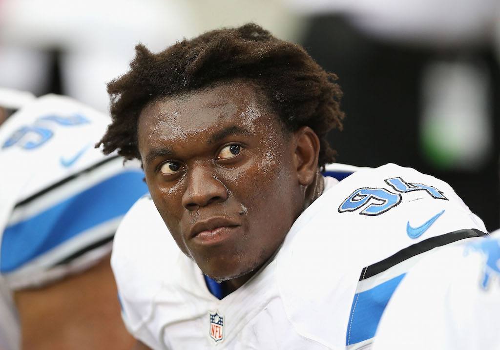Detroit Lions defensive end Ezekiel "Ziggy" Ansah rests during a game.