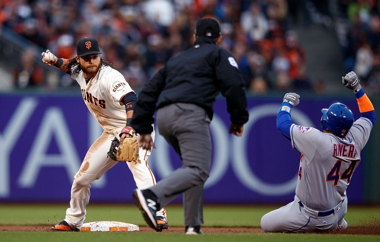 SAN FRANCISCO, CA - AUGUST 21: Brandon Crawford #35 of the San Francisco Giants completes a double play over Rene Rivera #44 of the New York Mets during the eighth inning at AT&T Park on August 21, 2016 in San Francisco, California. The New York Mets defeated the San Francisco Giants 2-0. (Photo by Jason O. Watson/Getty Images)